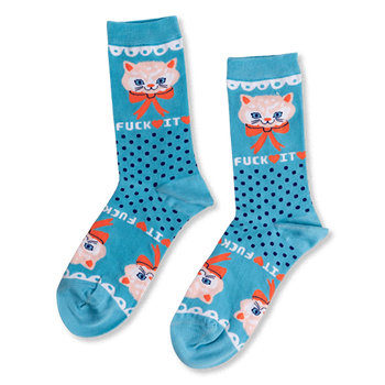 Pair of teal crew socks with dark blue polka dots. Features a light peach cat face, orange bow, and 'FUCK IT' text.