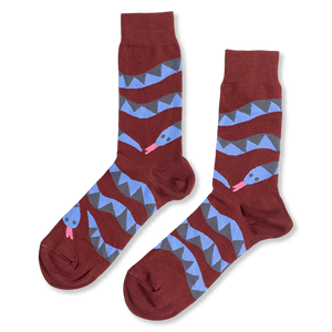 Pair of reddish-brown crew socks laid flat, featuring coiled blue and gray snake patterns with pink tongues, on a white background.