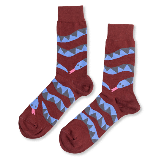 Pair of reddish-brown crew socks laid flat, featuring coiled blue and gray snake patterns with pink tongues, on a white background.
