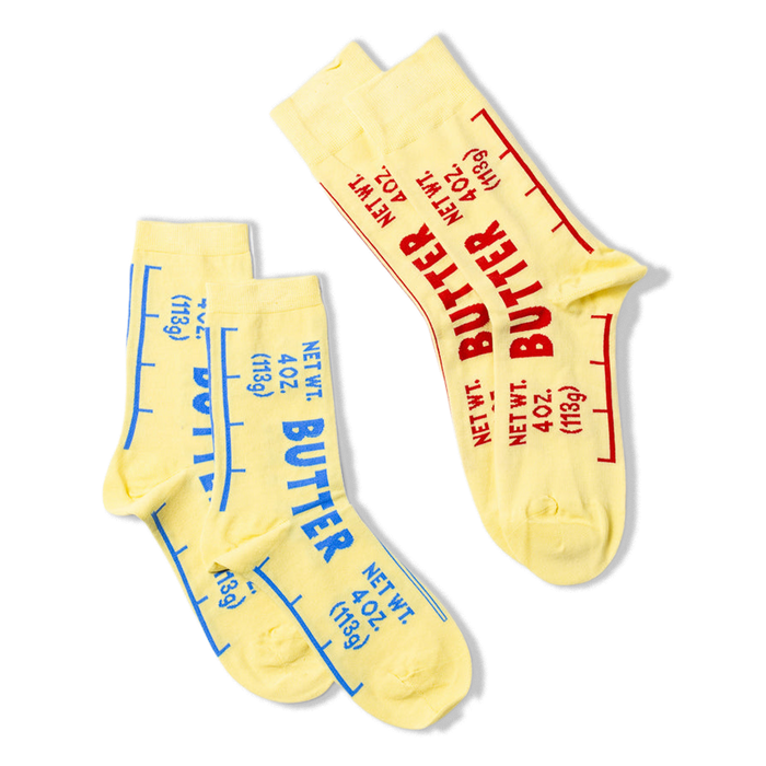 Three butter-themed ankle socks against a black background, two with blue text stacked on left, one with red text angled on right.