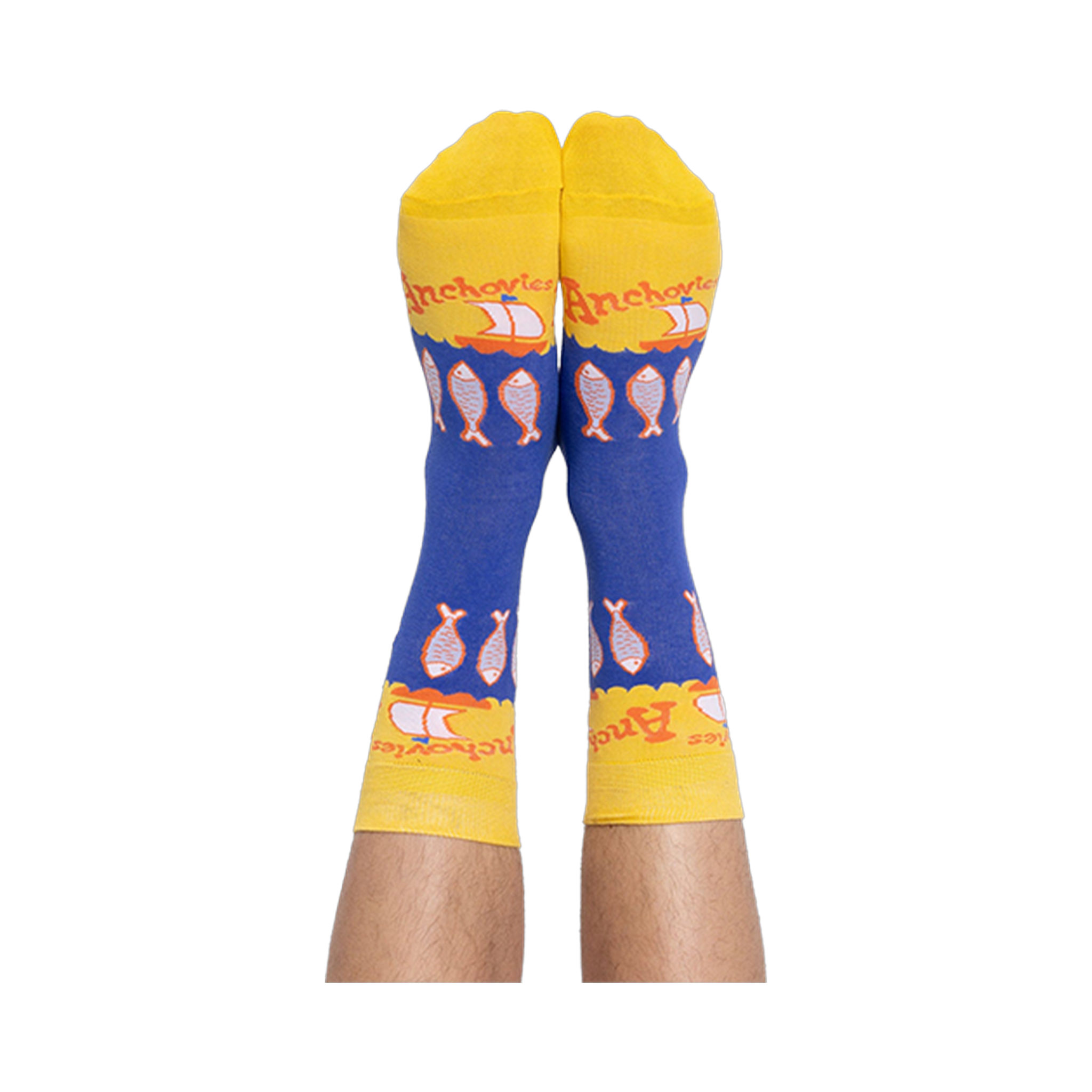 A person's feet wearing the blue and yellow anchovy crew socks, with the pattern of fish and text clearly visible.