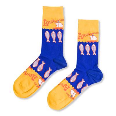 Pair of blue and yellow crew socks with a pattern of silver anchovy fish, 'Anchovies' text, and small sailboats.