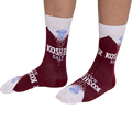 Person wearing deep red Kosher Salt crew socks, stretched over visible lower legs, showing the full design.