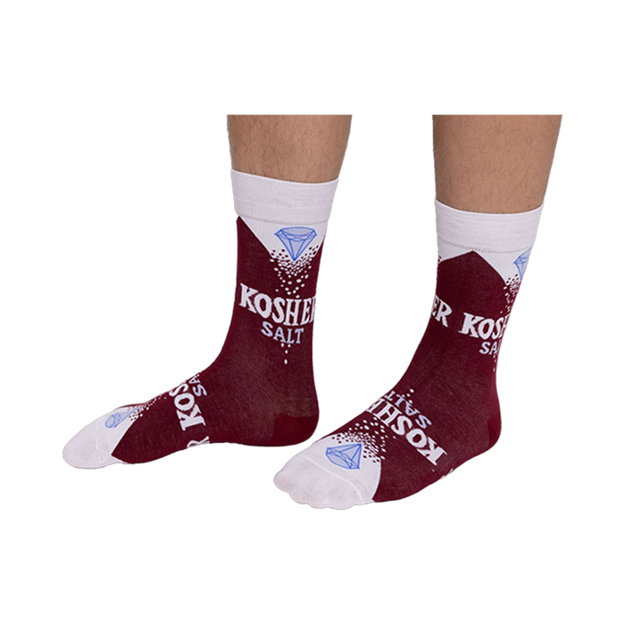 Person wearing deep red Kosher Salt crew socks, stretched over visible lower legs, showing the full design.