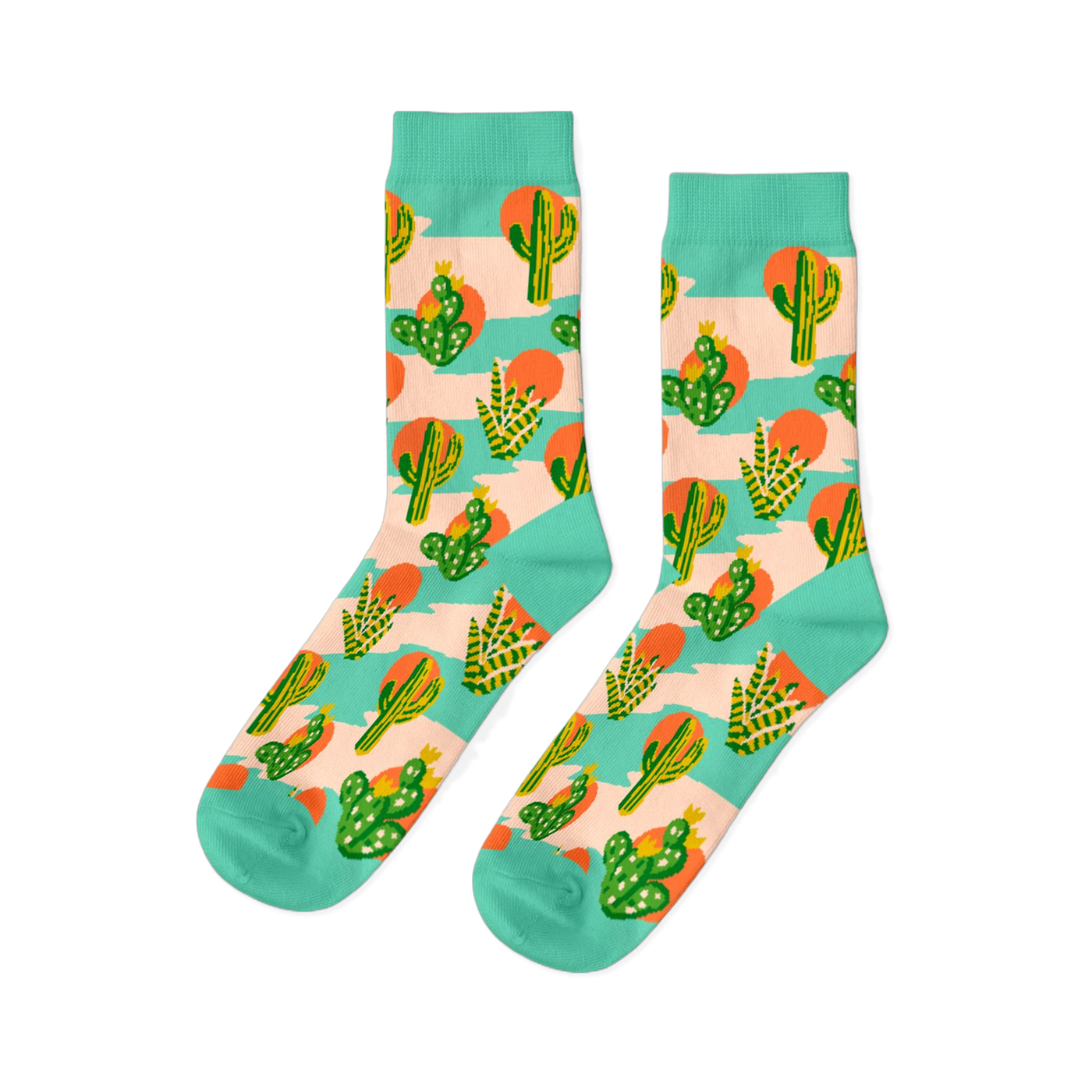 Pair of crew socks with a desert theme. Features green saguaro and prickly pear cacti, orange suns, on a peach-pink and mint green striped background.