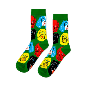 A pair of bright green crew socks featuring a repeating pattern of colorful cartoon dog faces in red, yellow, black, and blue.