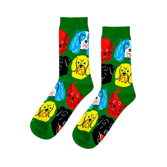 A pair of bright green crew socks featuring a repeating pattern of colorful cartoon dog faces in red, yellow, black, and blue.
