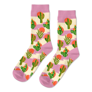 Pair of crew socks with a Southwest cactus pattern. Green cacti, orange suns, and lavender stripes on a cream background.