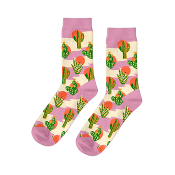 Pair of crew socks with a Southwest cactus pattern. Green cacti, orange suns, and lavender stripes on a cream background.