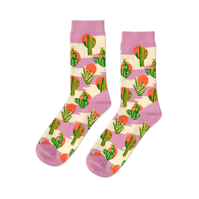 Pair of crew socks with a Southwest cactus pattern. Green cacti, orange suns, and lavender stripes on a cream background.
