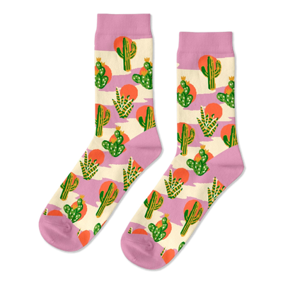 Pair of crew socks with a Southwest cactus pattern. Green cacti, orange suns, and lavender stripes on a cream background.