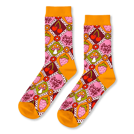 Pair of crew socks in a retro pattern. Features orange, pink, red, and green squares with cherries, strawberries, mushrooms, and the phrase 'fuck off'. }}