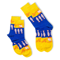 Two folded blue and yellow crew socks overlapping each other, showing the anchovy fish pattern and scalloped wave borders.