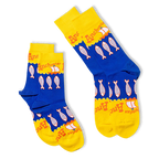 Two folded blue and yellow crew socks overlapping each other, showing the anchovy fish pattern and scalloped wave borders.