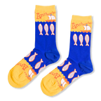 Royal blue crew socks with an anchovy pattern, featuring bright yellow toes and cuffs with retro orange text and sailboats.