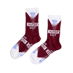 Pair of maroon crew socks with white cuffs. Design features a light blue diamond, "KOSHER SALT" text, and white salt-like dots.