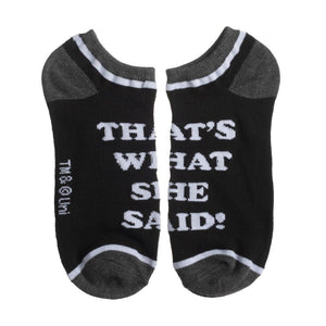 A pair of black socks with gray toes and heels. The socks have white text on them that reads, 