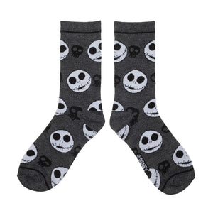 A pair of gray socks with a pattern of Jack Skellington faces from The Nightmare Before Christmas.