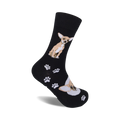 A pair of black crew socks with a tan Chihuahua and paw print design. 