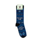 Product shot of 'I'm On The Very Naughty List' socks on their packaging. Shows the full sock design and branding.