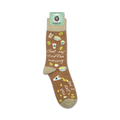 A lifestyle shot showing the socks on a person's feet. The socks have a light brown base with coffee-themed illustrations and text.