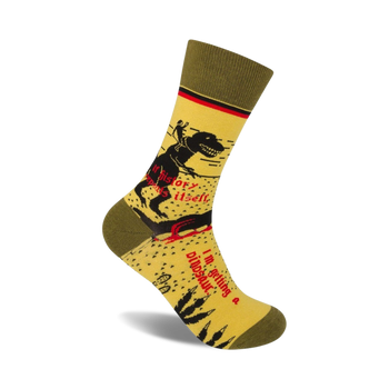 yellow crew socks with green cuff and red toe and heel. pattern of dinosaur skeleton riding a bicycle. text on socks: "if history repeats itself...i'm getting a dinosaur".  