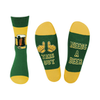 Crew socks in green and gold. One sock shows a beer mug, the other says 'This Guy Needs A Beer'.