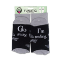 Product packaging of 'Go Away I'm Reading' socks showing the full design on both socks.