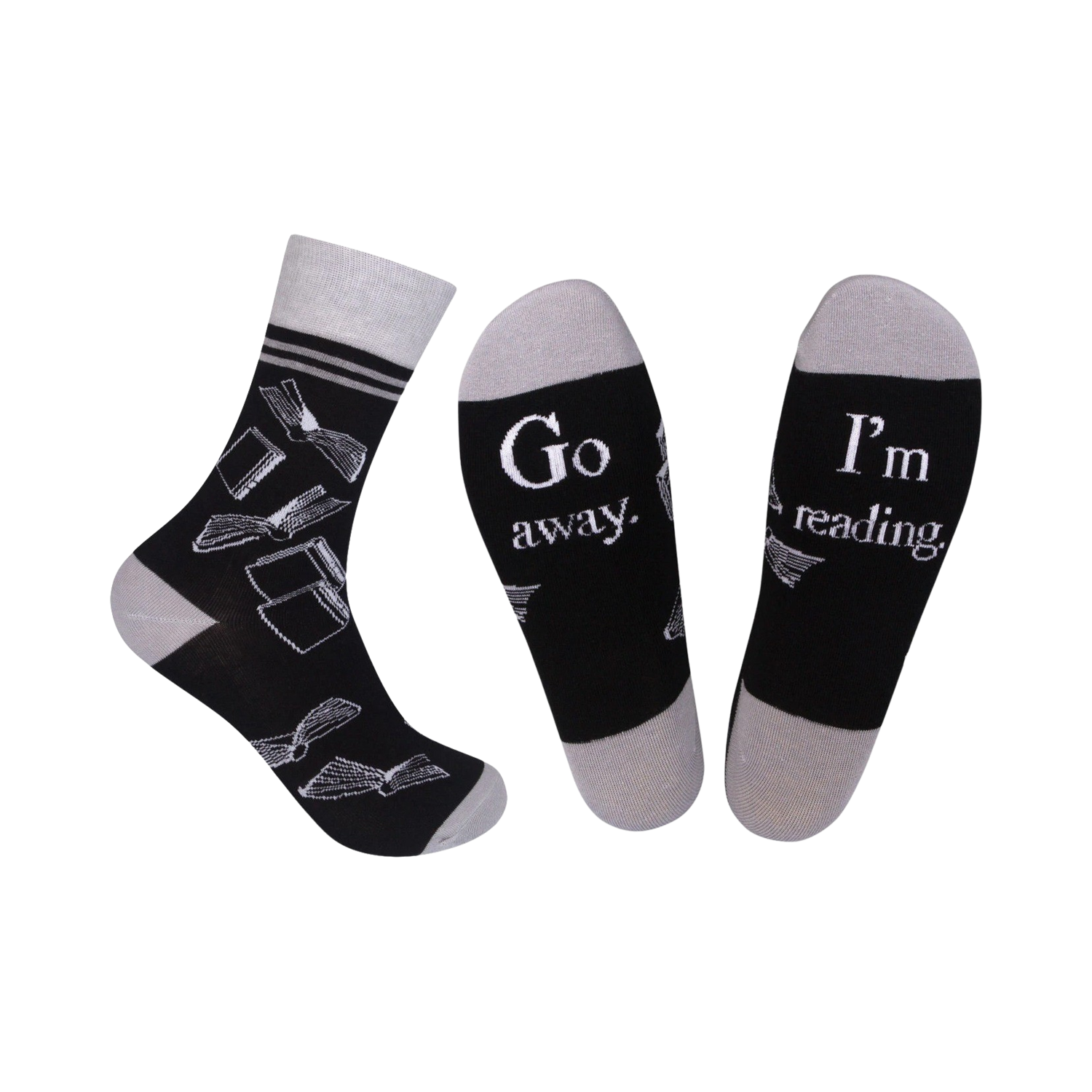 A pair of black crew socks with a grey cuff. The socks feature a white design of open books and the phrases 'Go Away' and 'I'm Reading'.