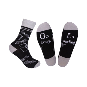 black & gray crew socks with a book pattern and the words 