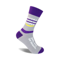 Crew socks in gray and purple with white text reading, 'Books Make Me Happy' and 'You, not so much.' A yellow smiley face is also featured.