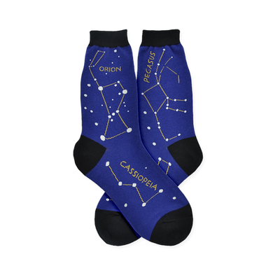 Dark blue Constellation socks featuring Orion, Pegasus, and Cassiopeia constellations with white stars and yellow lines.