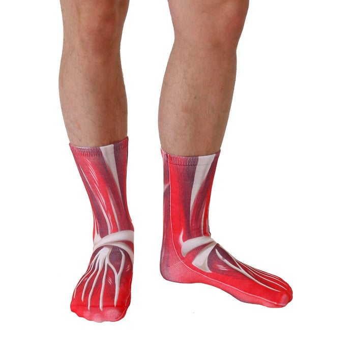 A pair of red socks with a realistic muscle design.