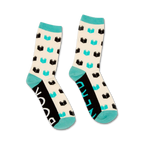 Lifestyle shot of a person's feet wearing the 'Book Nerd' socks, showcasing how they look when worn.