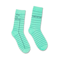 Pair of mint green crew socks with a library card design.  The dark teal lines mimic the lines on a library card.  'Author, Title, Date Due' is printed on one sock.