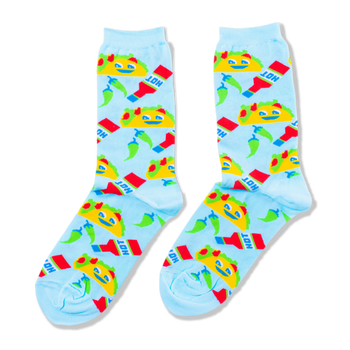 A pair of light blue crew socks covered in a pattern of yellow smiling tacos, red hot sauce bottles, and green chili peppers.