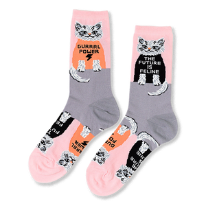 Pair of crew socks in pink and grey, patterned with white cats wearing black and orange shirts with 