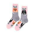 Pair of crew socks in pink and grey, patterned with white cats wearing black and orange shirts with "GURRRL POWER" and "THE FUTURE IS FELINE".