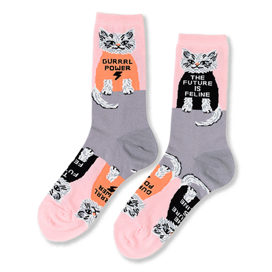 Pair of crew socks in pink and grey, patterned with white cats wearing black and orange shirts with 