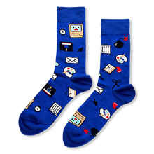 Royal blue socks featuring a pattern of retro computer icons like a smiling monitor, floppy disk, bomb, and paint palette.