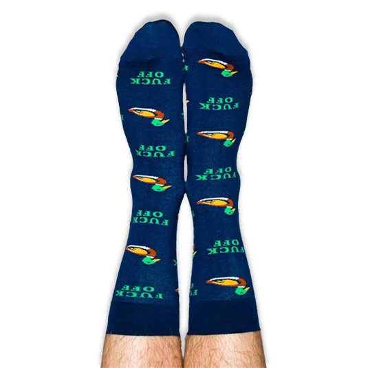 Person wearing navy blue crew socks on their legs, displaying a pattern of mallard ducks and green FUCK OFF text.