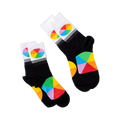 Two pairs of black crew socks with white cuffs and colorful color wheel segments, laid flat on a white surface.