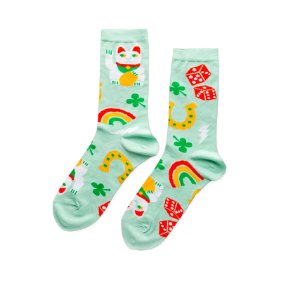 Pair of mint green crew socks patterned with white Lucky Cats, green clovers, yellow horseshoes, red dice, and colorful rainbows.