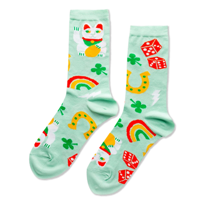 Pair of mint green crew socks patterned with white Lucky Cats, green clovers, yellow horseshoes, red dice, and colorful rainbows.