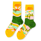 Yellow and green crew socks reading West Coast with palm trees and a sunset, and Best Coast with pine trees and mountains.
