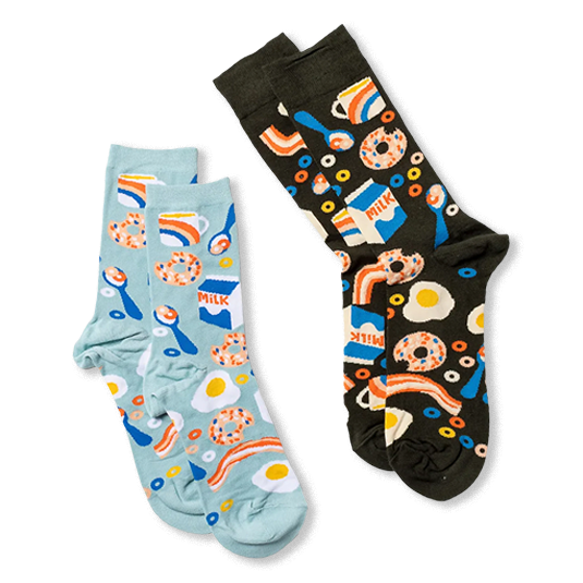 Light blue breakfast socks next to a dark grey pair featuring the exact same food pattern of eggs, bacon, and milk.