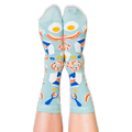 Front view of a person wearing light blue breakfast socks with their legs extended upwards against a dark background.