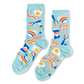 Light blue crew socks with a breakfast pattern showing fried eggs, bacon, milk cartons, donuts, and coffee cups.
