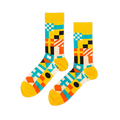 Pair of crew socks with a vibrant geometric nautical flag pattern in yellow, blue, orange, black, and white.
