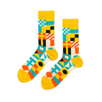 Pair of crew socks with a vibrant geometric nautical flag pattern in yellow, blue, orange, black, and white.